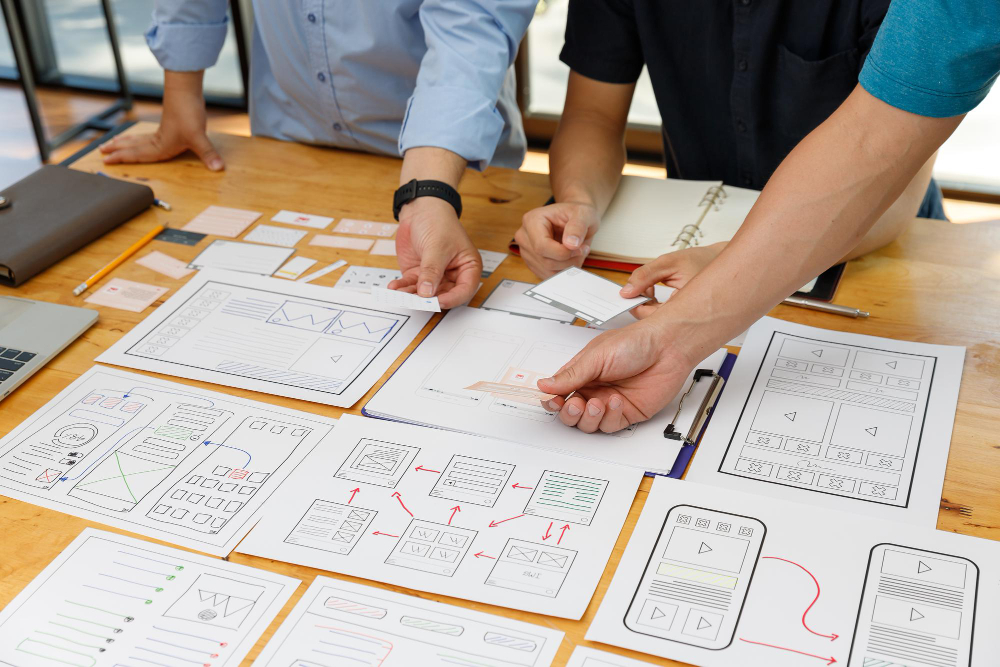 Graphic designers work together with ux ui designer planning application